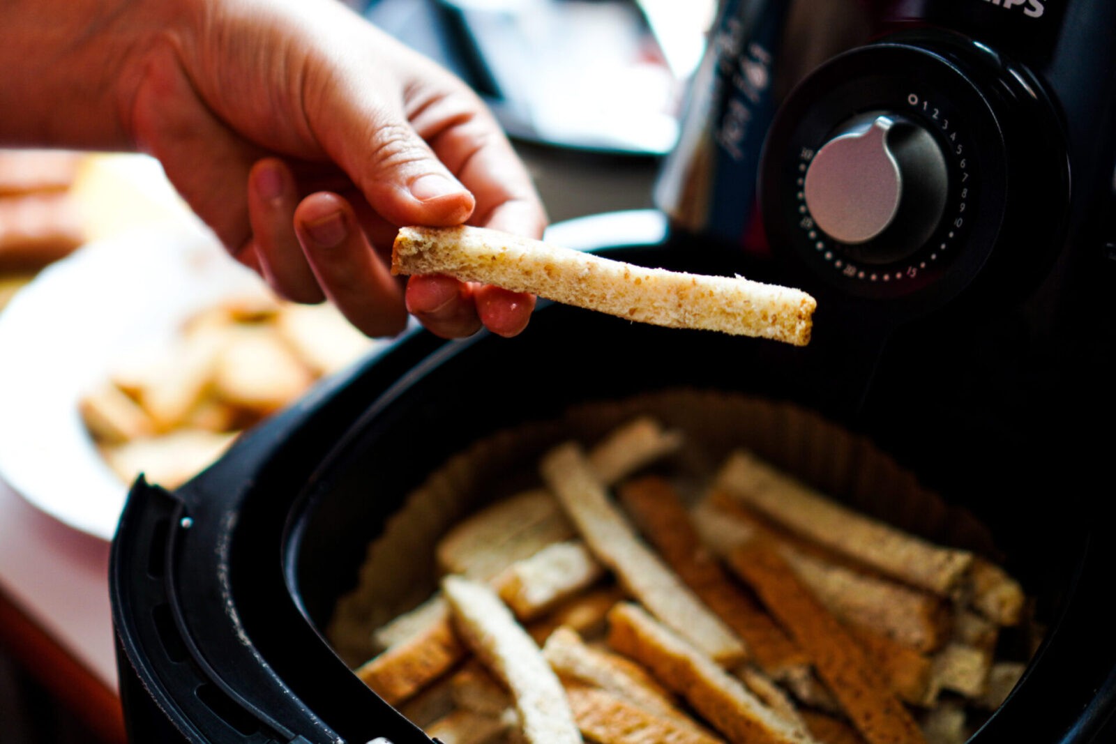 A Bread Stick Being Baked In A Deep Fryer In A Home Kitchen.